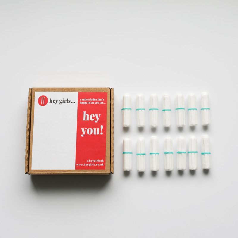 box of non-applicator tampons with tampons beside it