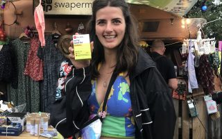 girls holding a hey girls menstrual cup on Glastonbury Swapermarket