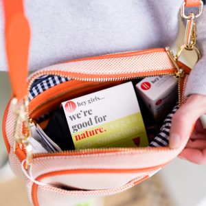 view of a women's bag containing Hey Girls products with the inscription 'good for nature'