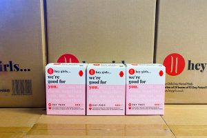 boxes of day pads with cartons in the background