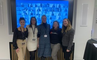 Ailsa from Hey Girls and abrdn staff in front of projector screen