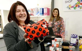 Inverness College students with Hey Girls Products in their student shop